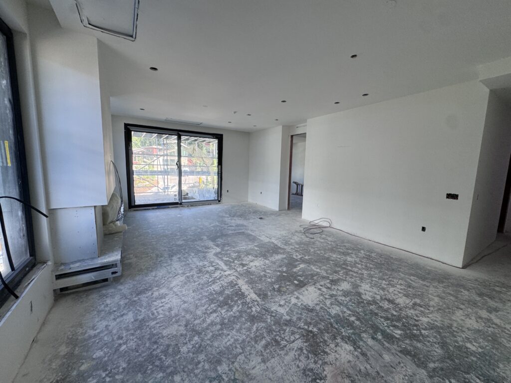 Drywall installation is now complete through level 5 of the West Building, bringing the interior spaces into sharp focus. 