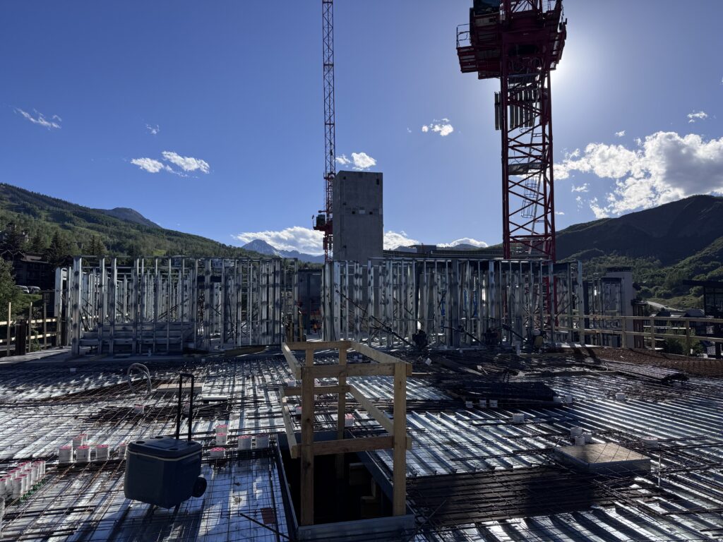 Viewed from the level 6 deck, the East Building continues its rapid ascent with interior framing advancing across the upper levels. 